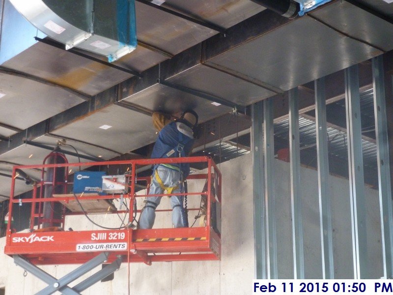 Welding black iron duct work at the 4th floor Facing South